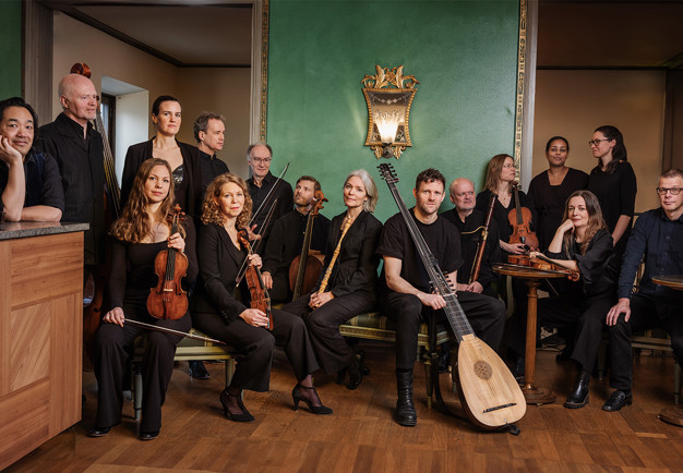 Musicians standing in a row. Photo.