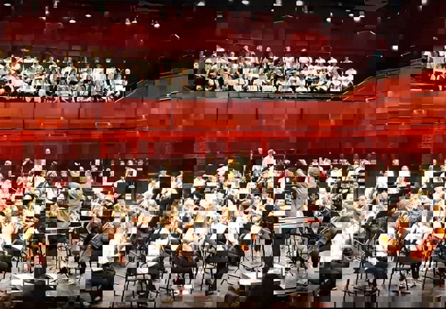Orchestra with young people. Photo.